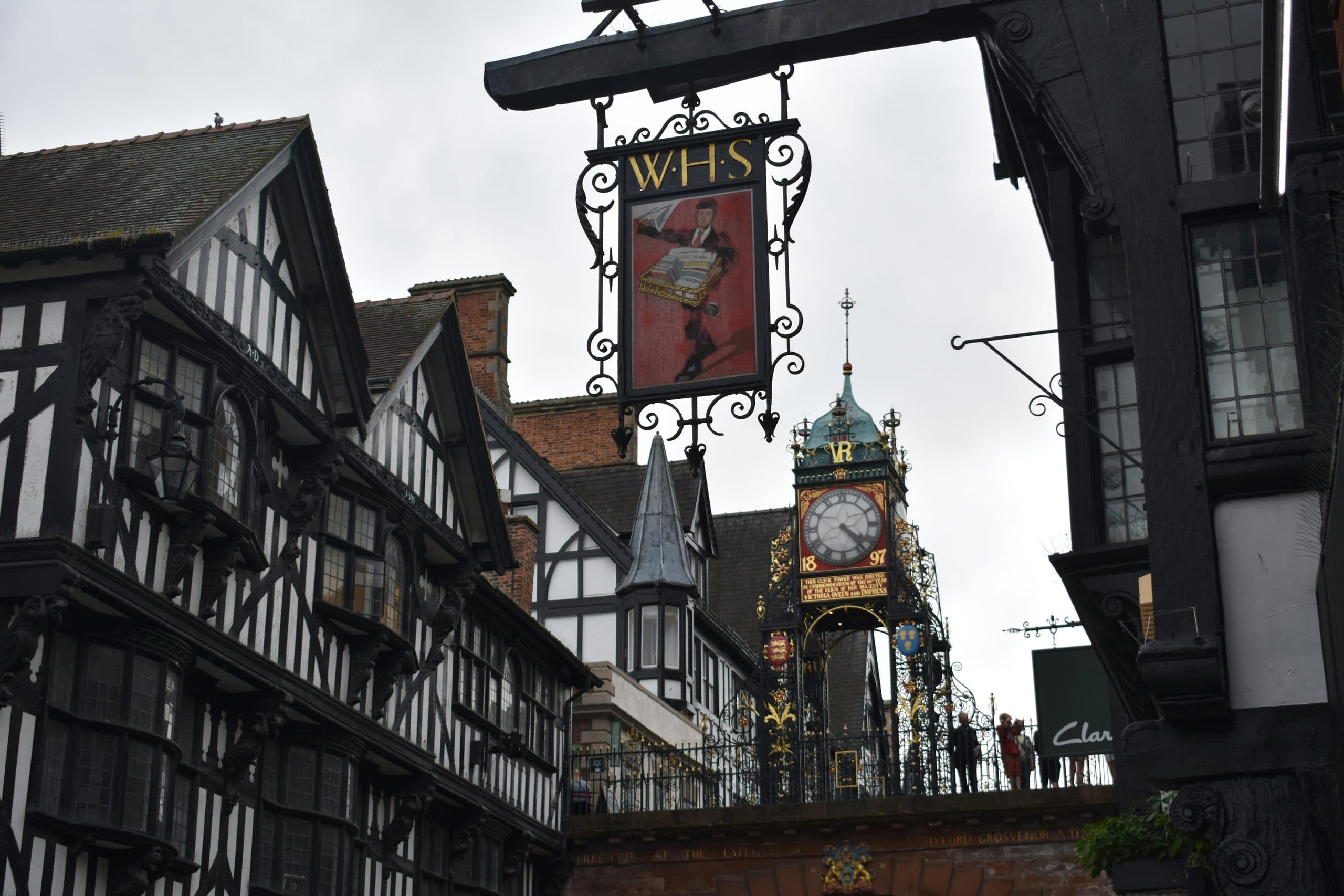 Chester's Eastgate Clock above the black-and-white Tudor Rows on Eastgate Street