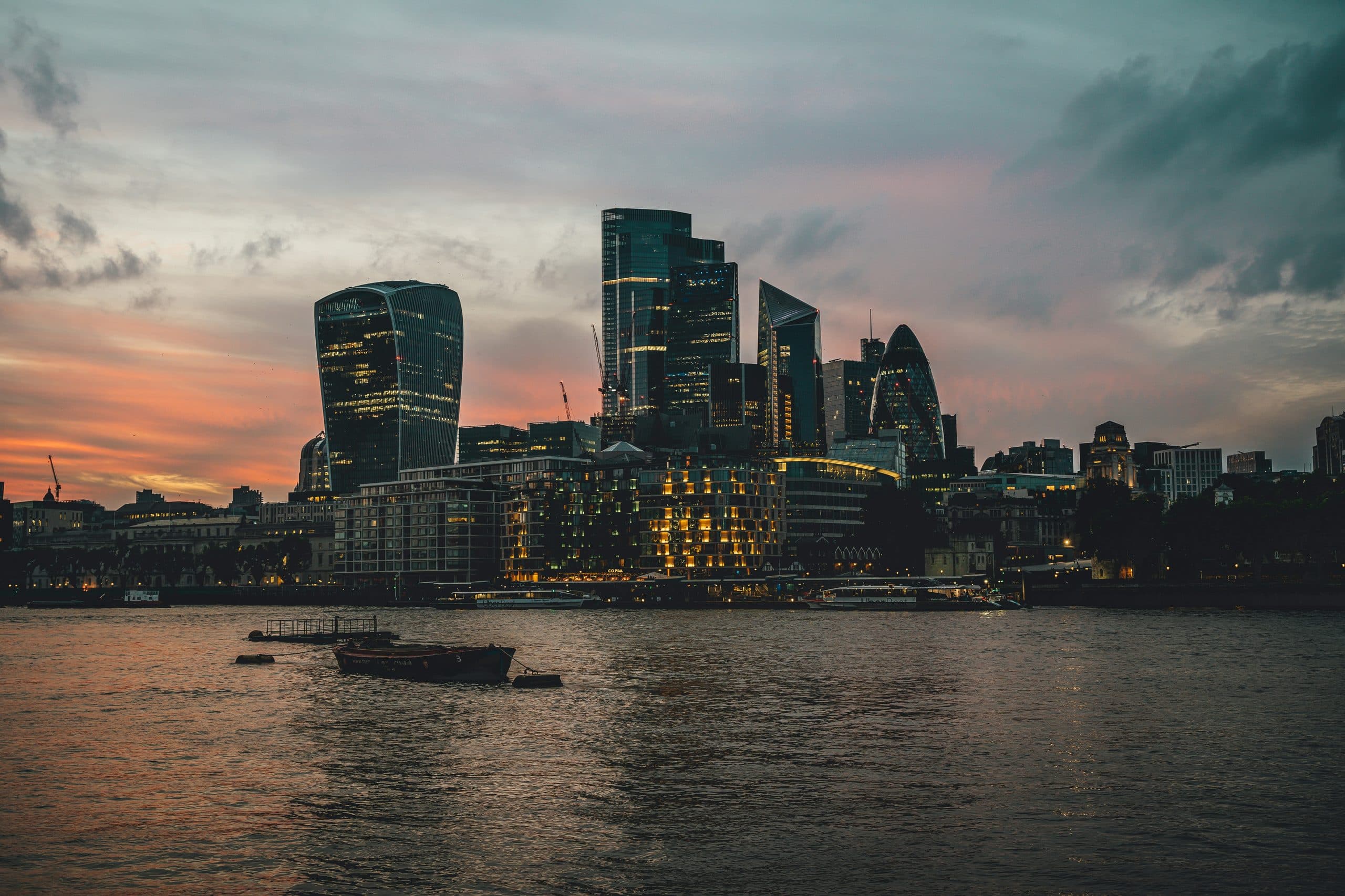 The City of London skyline at sunset across the Thames, with the Walkie-Talkie, Cheesegrater and Gherkin